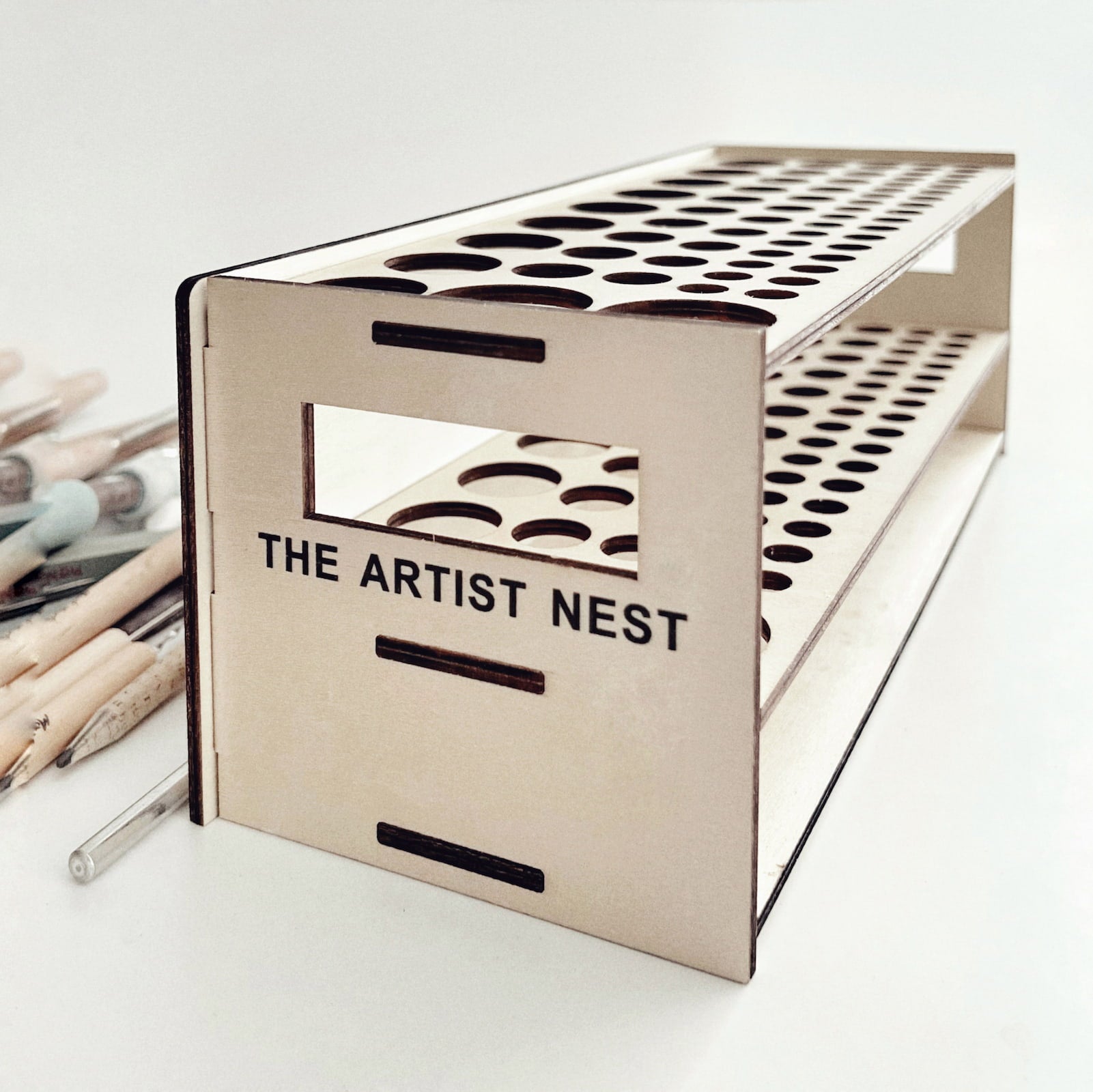 * Empty Ceramic Tool Rack by The Artist Nest showing different hole sizes for pottery tools