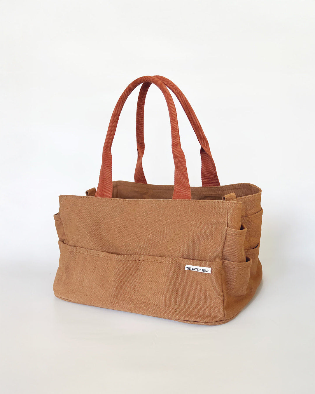 Outback Artist Bag in a diagonal view, canvas art supply bag with 18 exterior pockets and nine tall interior pockets, designed for artists and makers in Australia.