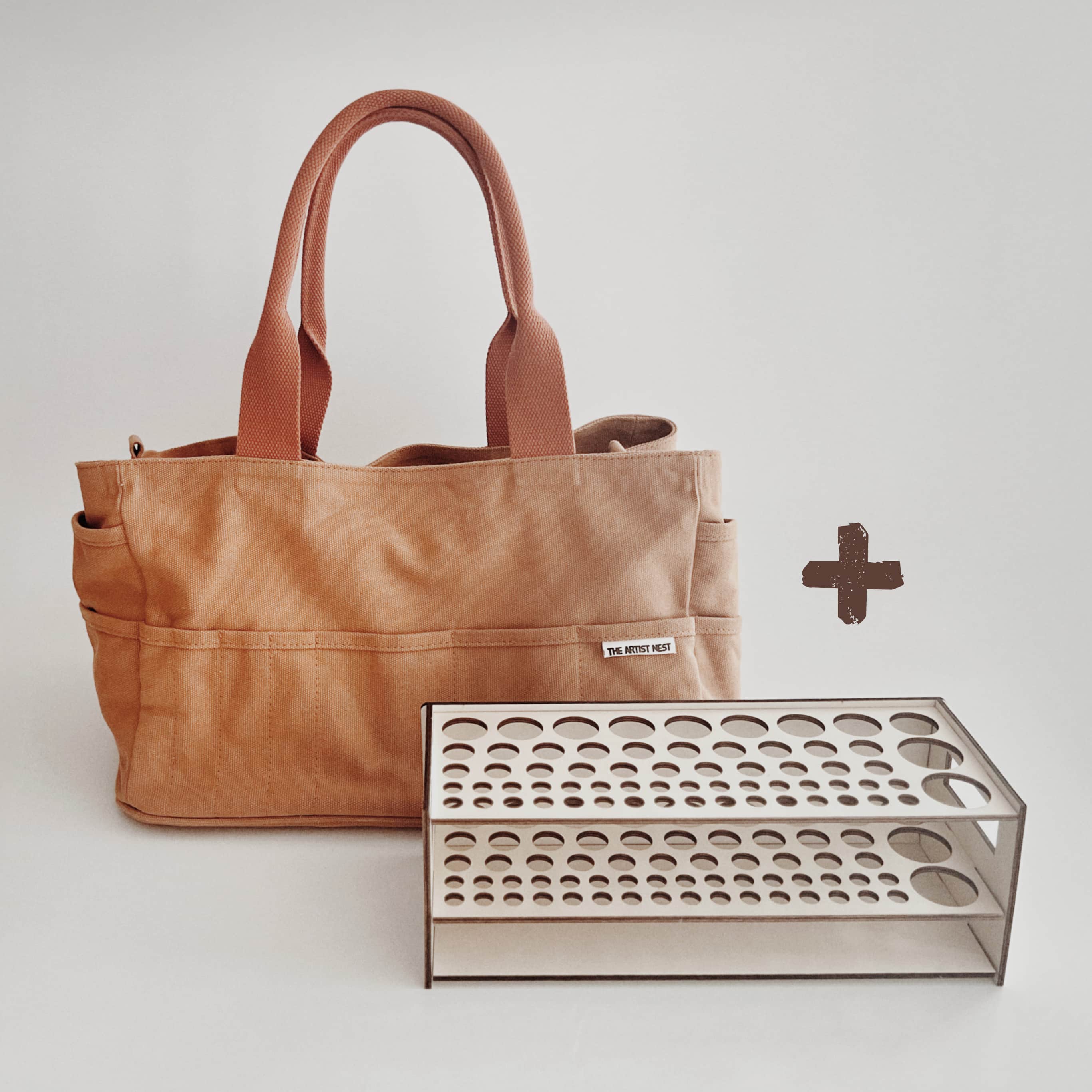 Outback artist bag shown together with an empty wooden tool rack, representing a modular and flexible tool organisation system.