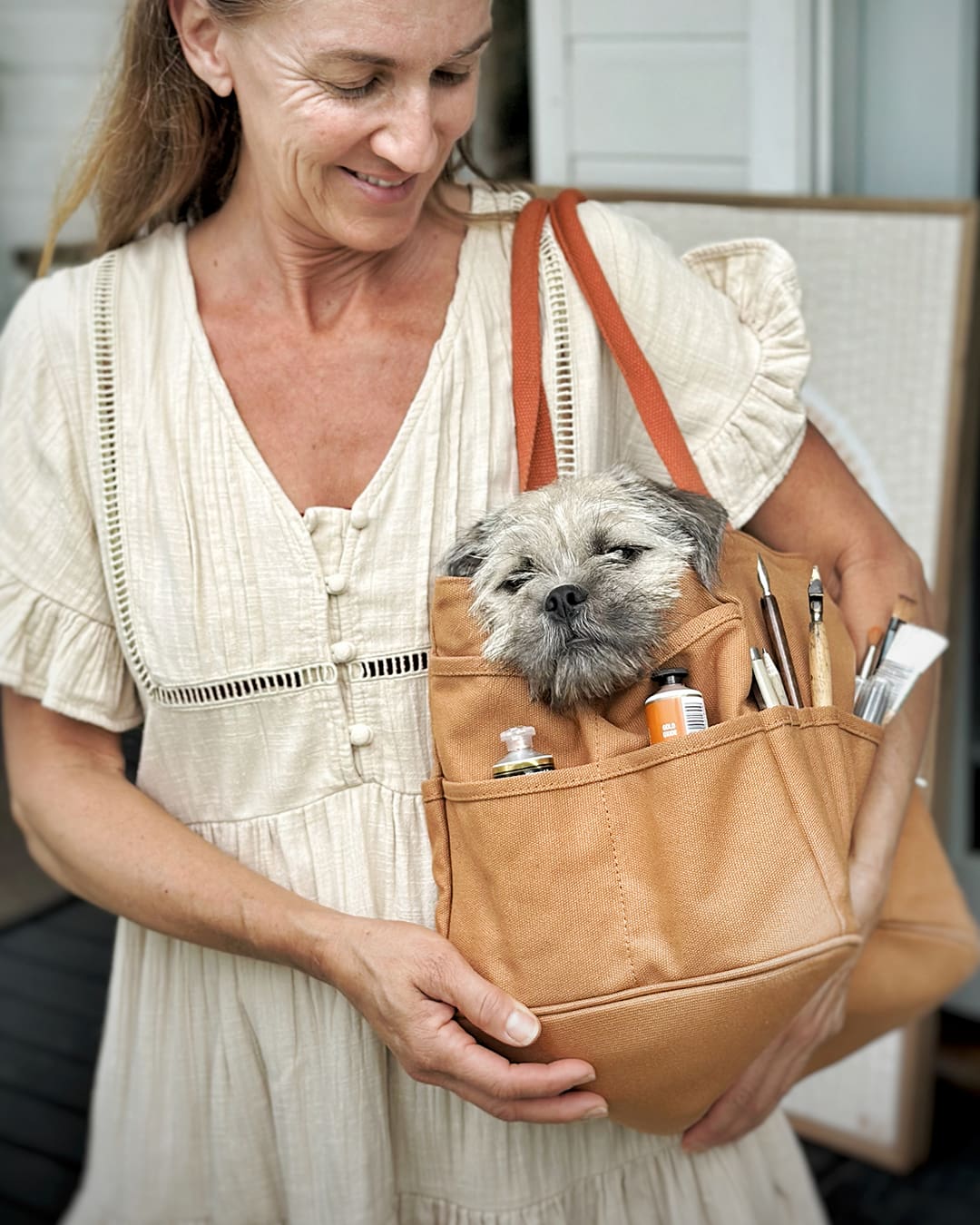 Outback Artist Bag used as a lifestyle carry tote with art tools and a small dog inside, a versatile canvas bag for everyday creative life in Australia.